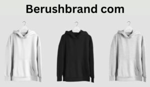 Three Berushbrand com hoodies in white, black, and gray displayed on hangers against a light background. - NEWS TAKER